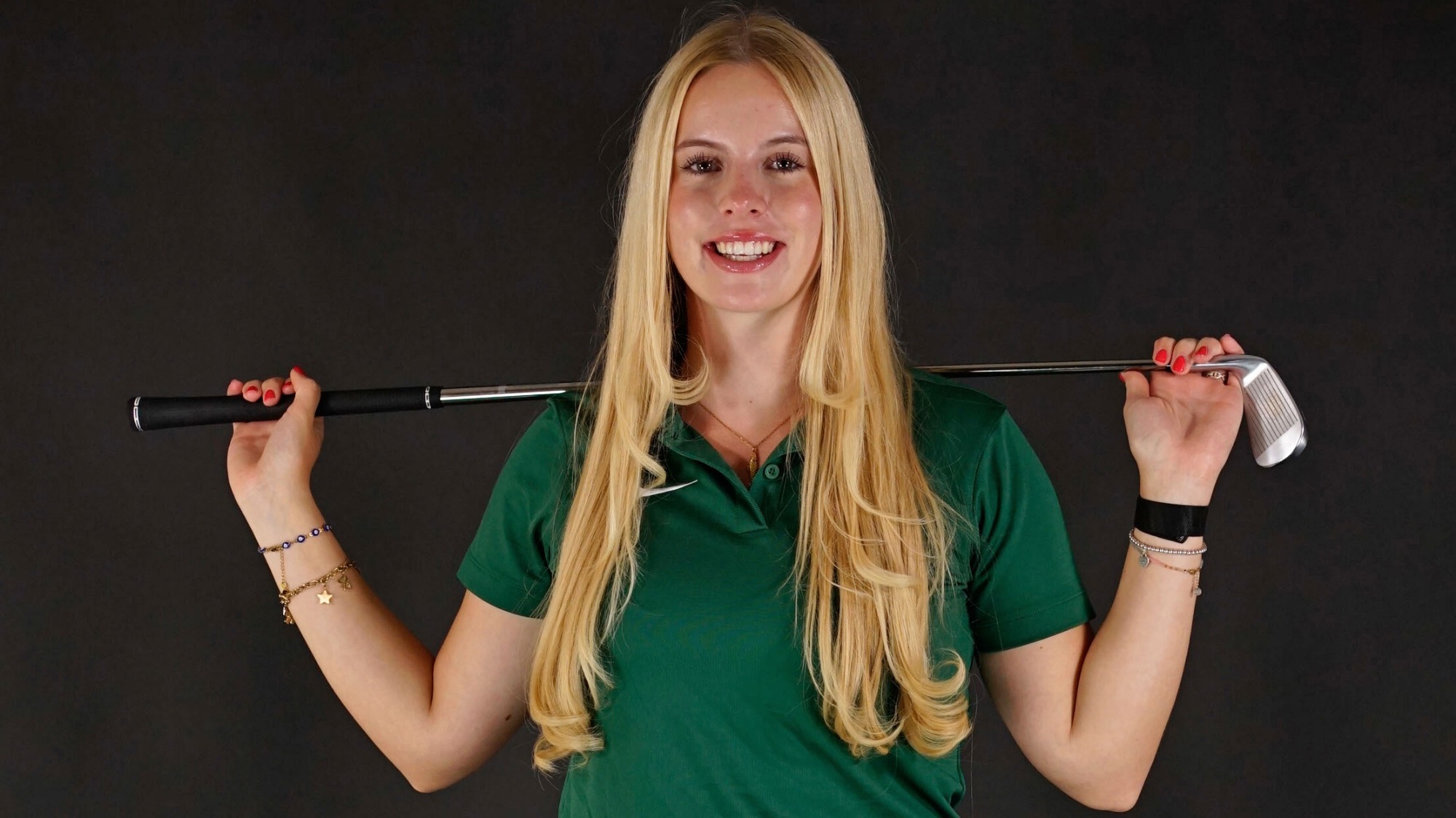 Emilia Schneider poses with the club over her shoulders