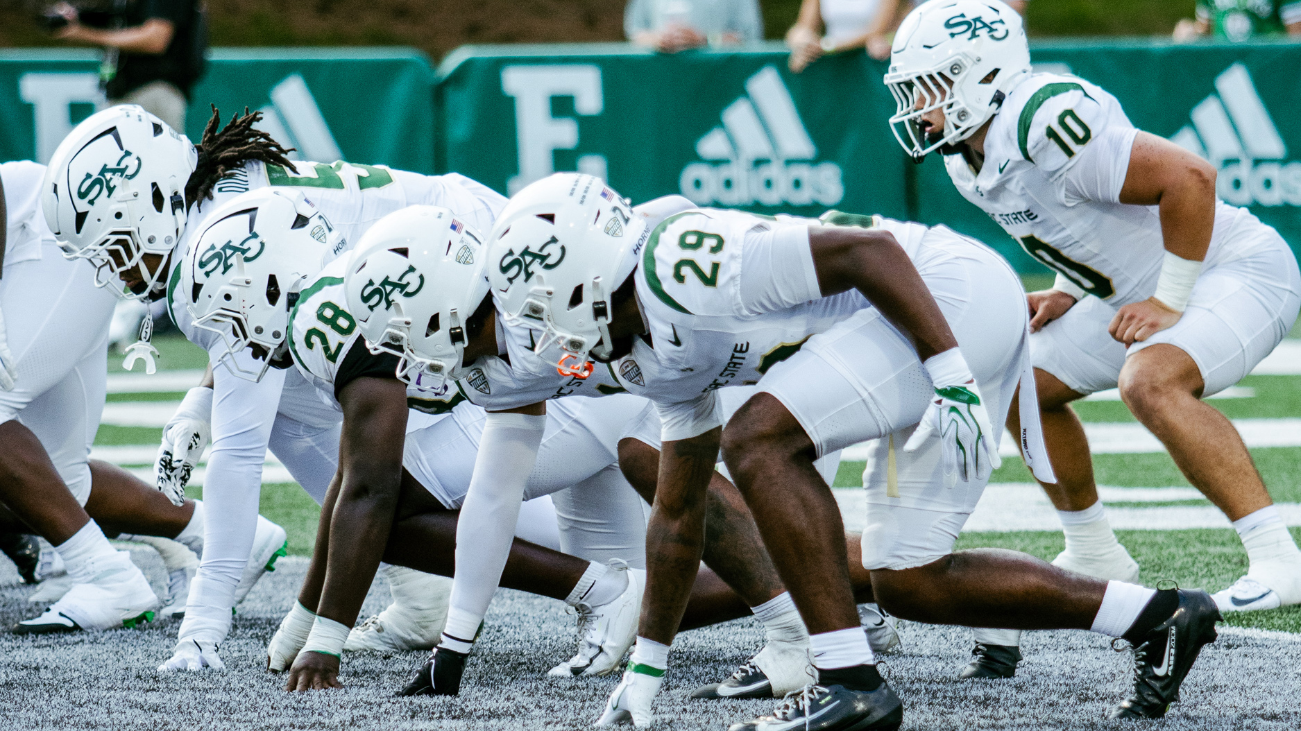 Five players lined up to block a punt