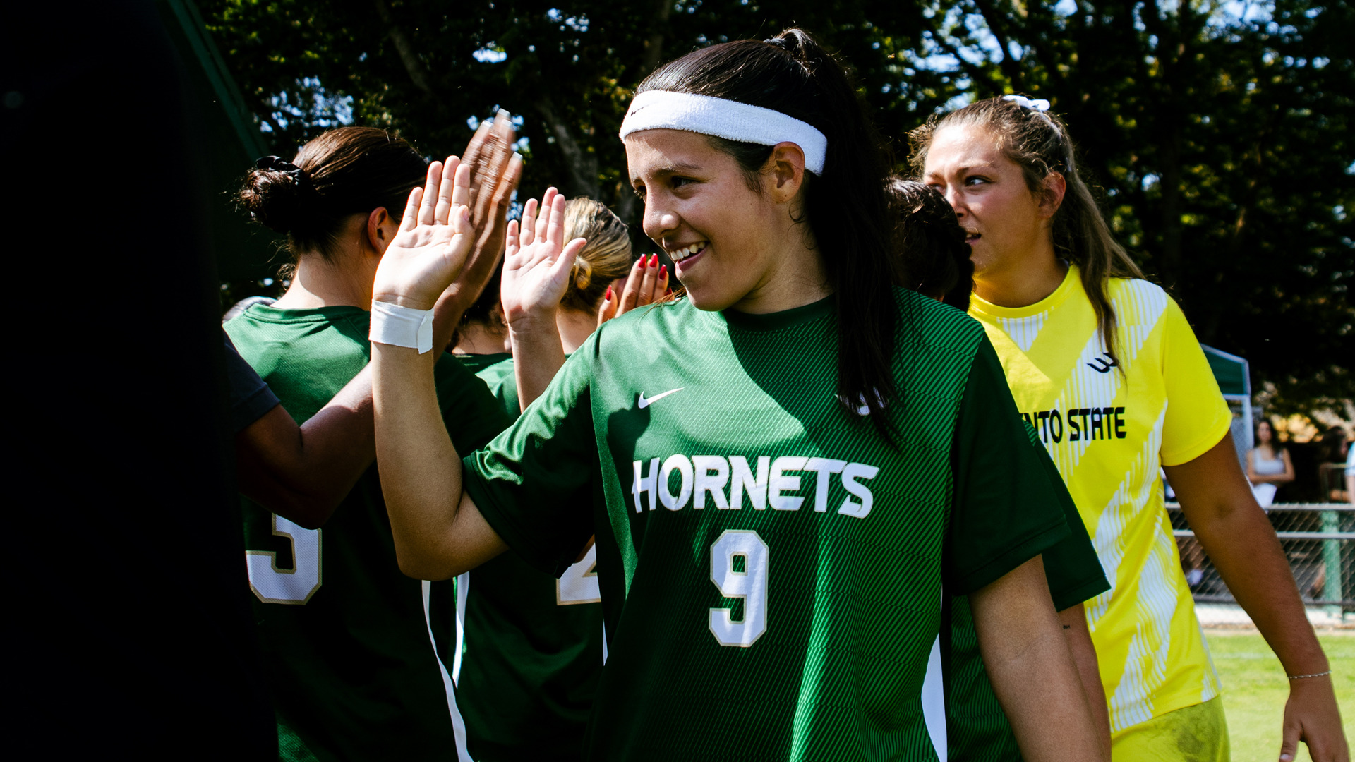 2026 WSOC Marely Velasquez Varela high fives her teammates following a match against UC Irvine