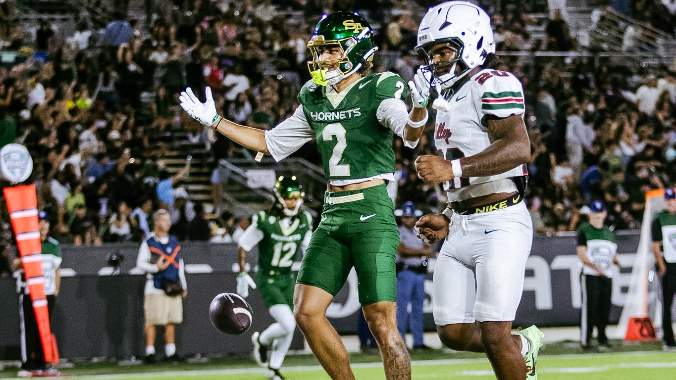 Matt Coleman looks to the crowd after his second TD
