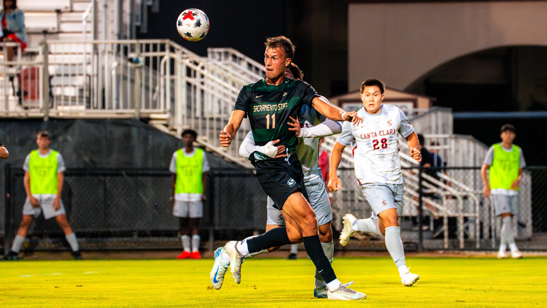 2026 MSOC Sean Battistessa battles a Santa Clara defender with the ball in the air during a preseason exhibition