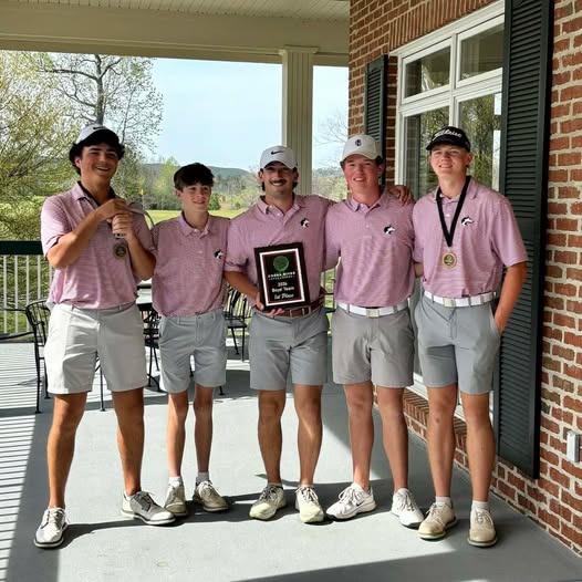 Male golfers holding plaque 