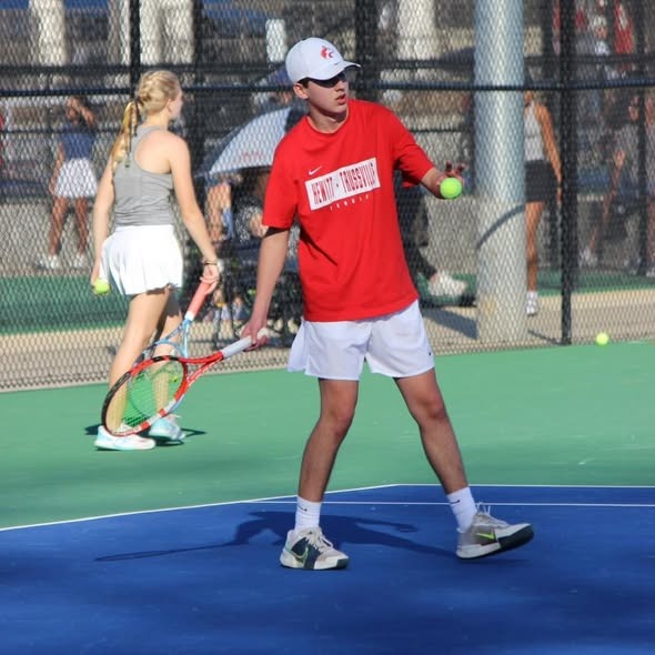 Male tennis player serving 
