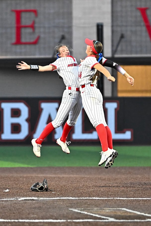 Softball players celebrating