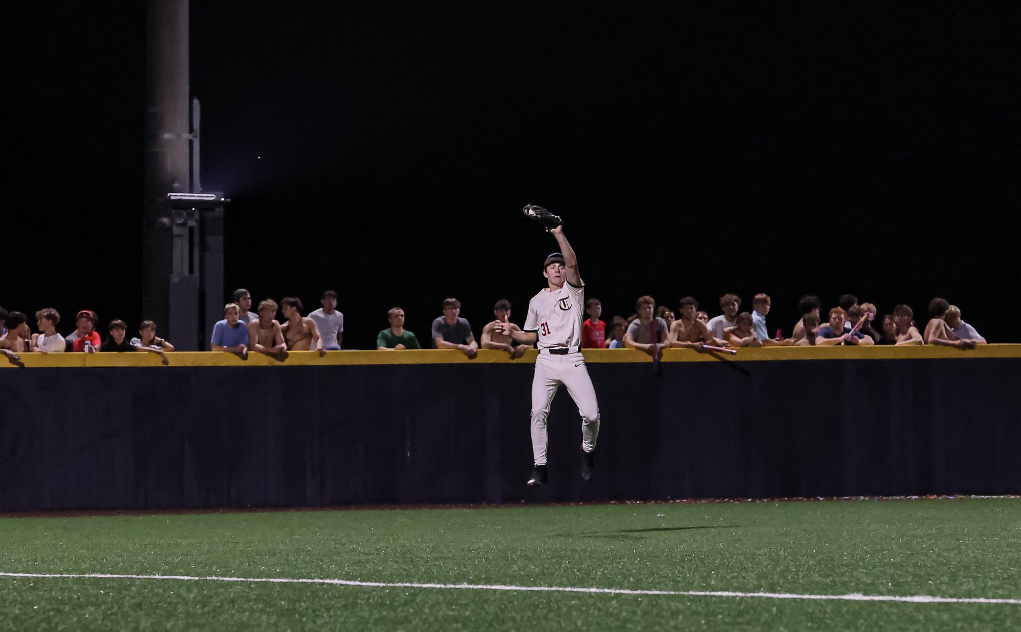Player jumps for an out 