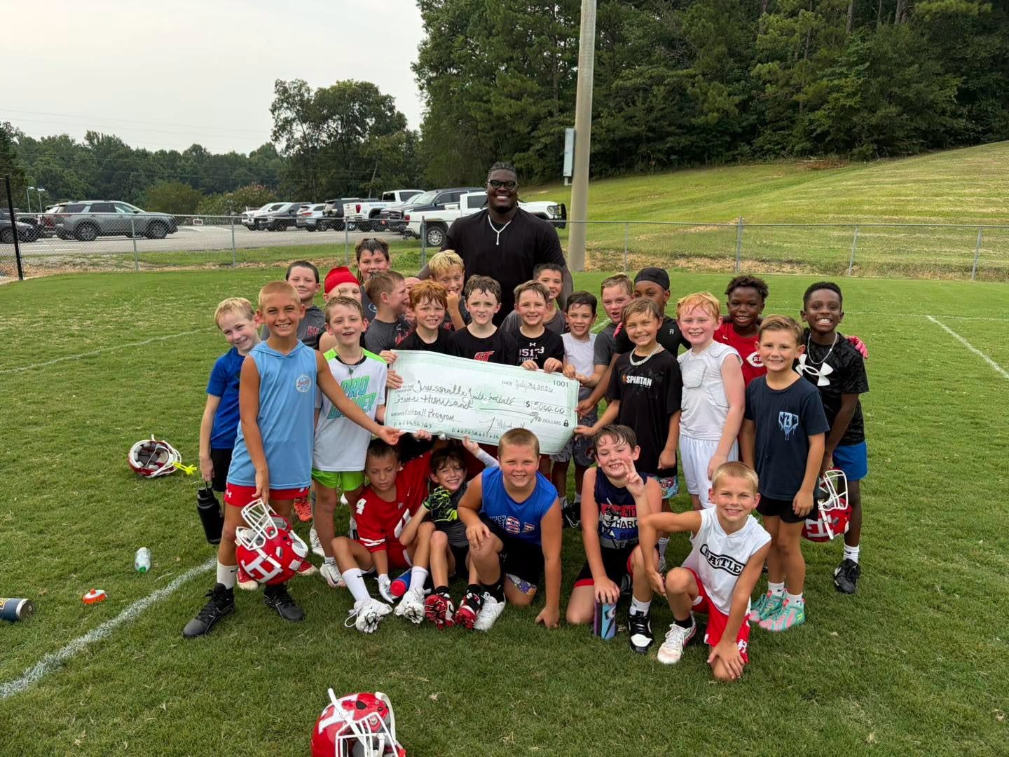 Former husky donates to youth team and varsity football. 