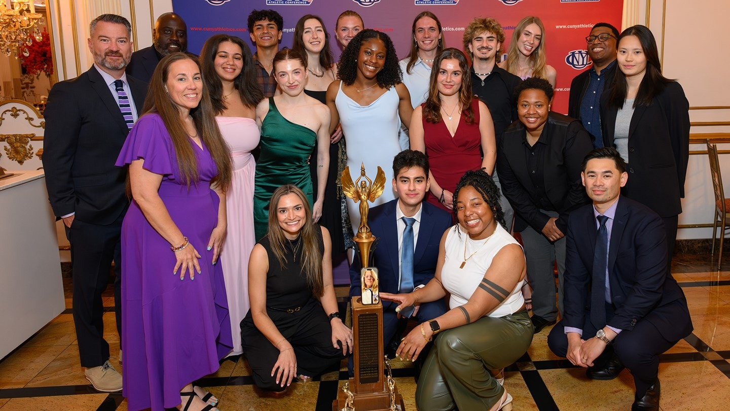 Hunter College Athletics administration, staff, coaches, and student-athletes pose for a photo after being named the 2025-26 Commissioner's Cup winner.