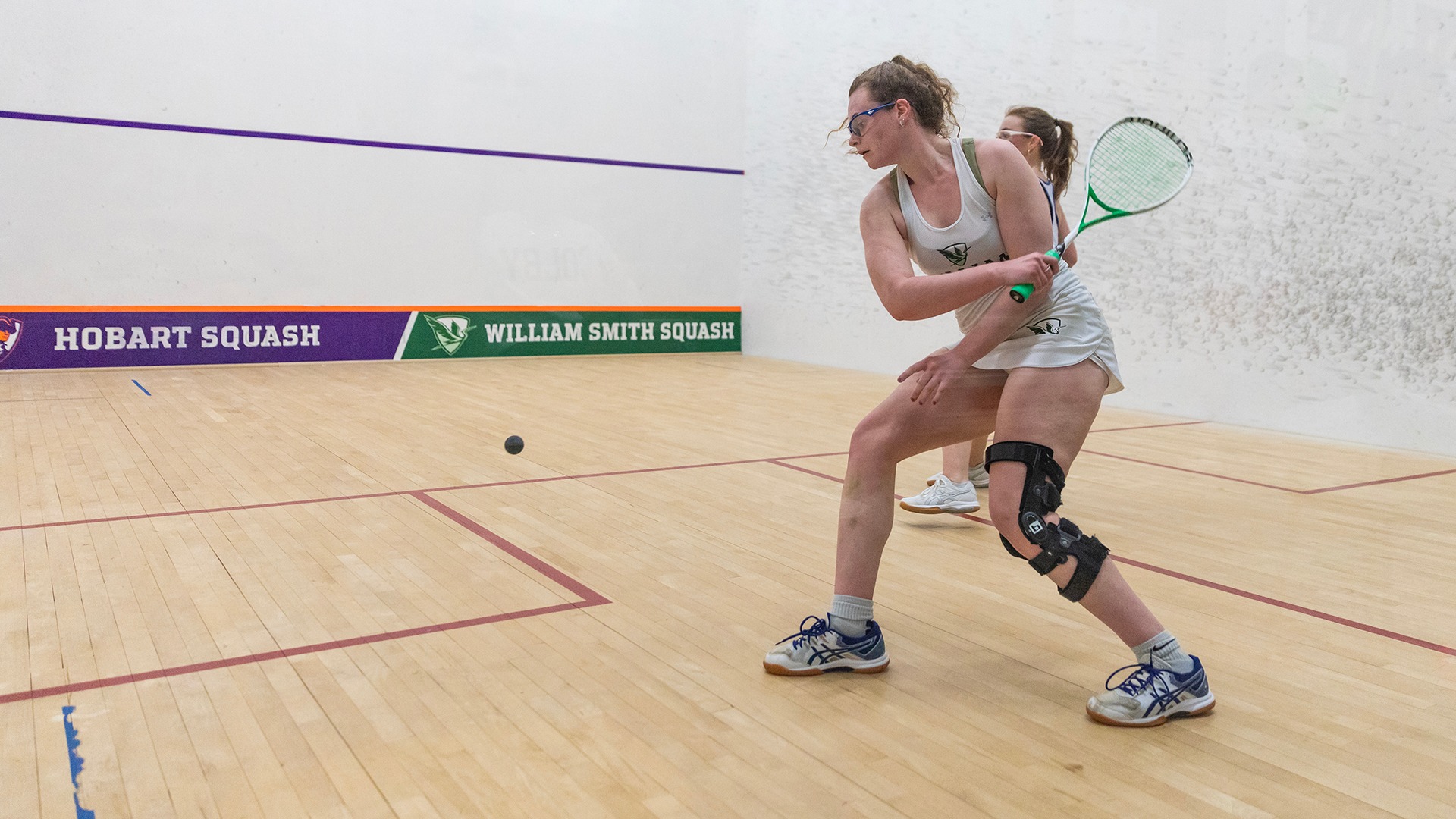 Jessica Finnerty hits a backhand against Colby