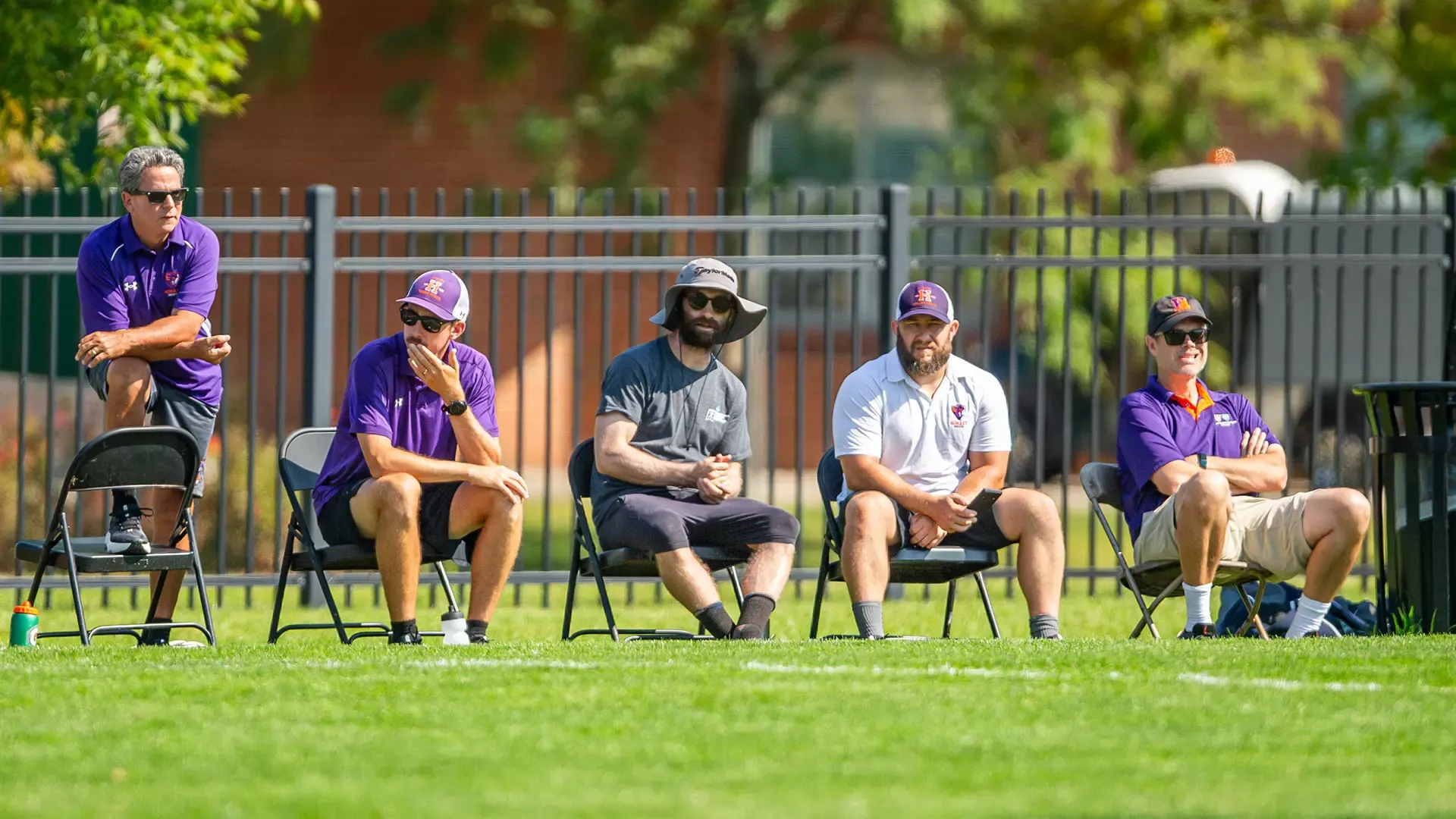 Hobart Soccer coaches watching the match