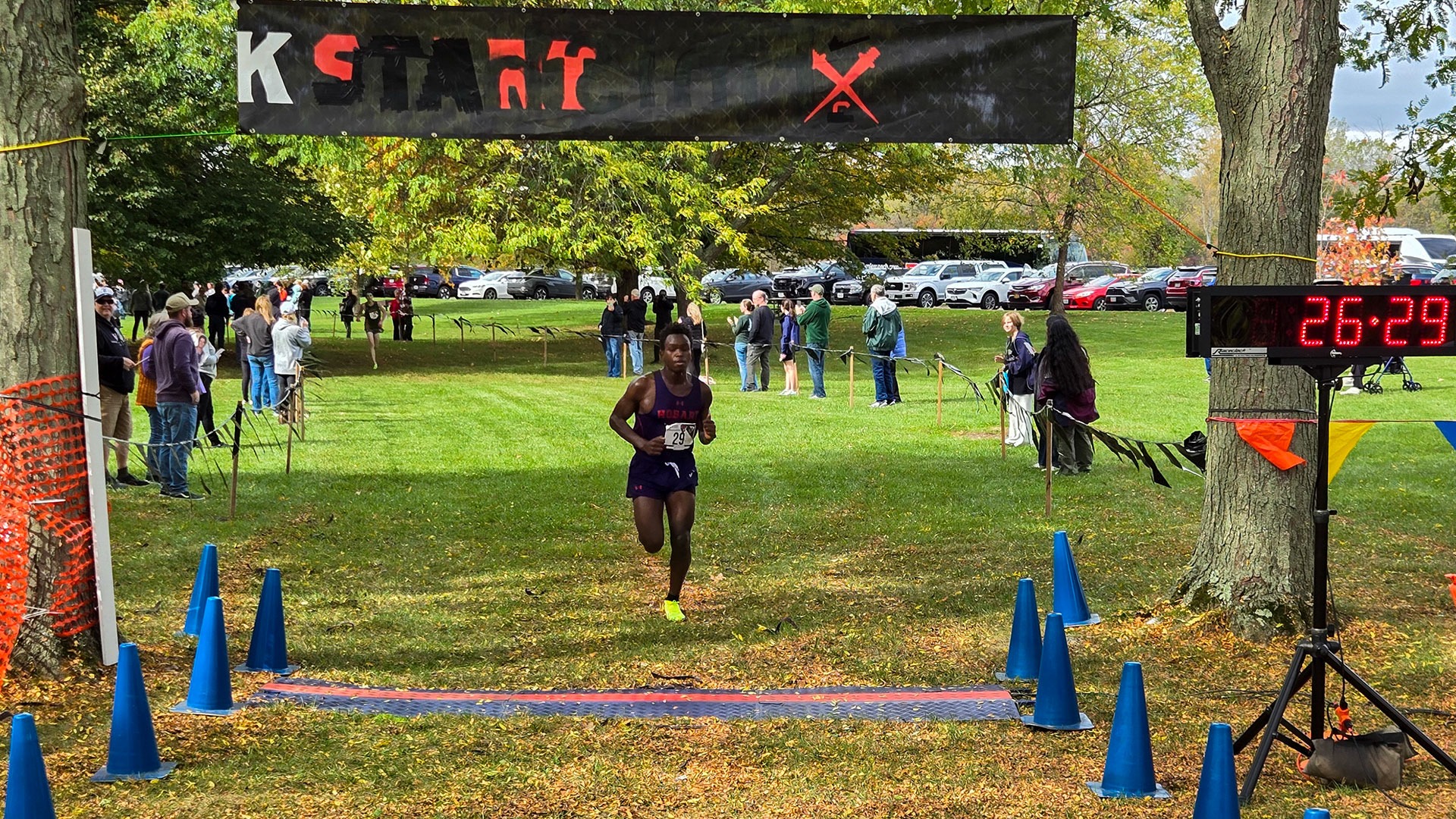 Duncan Kipkoech crosses the finish line at CCOC