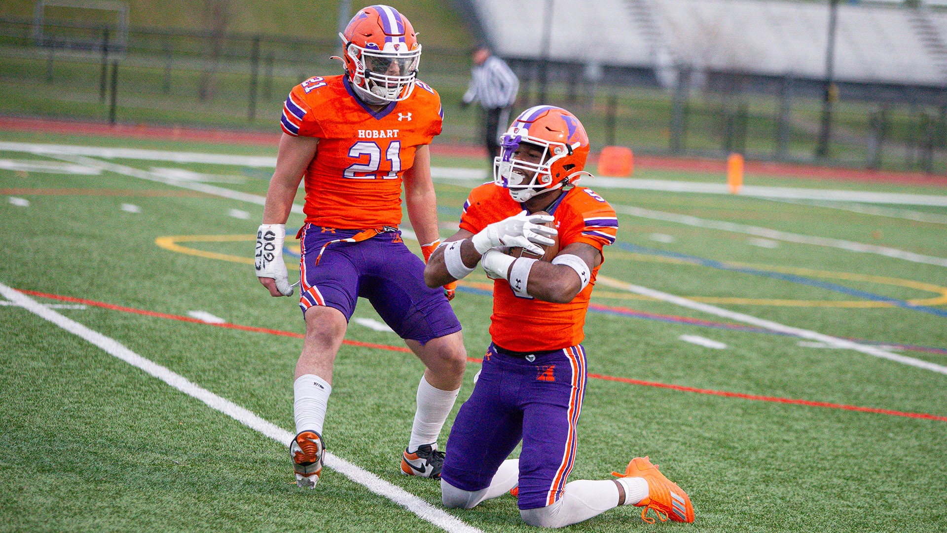 Mike McGhee celebrates an interception by Zeshan Dixon.
