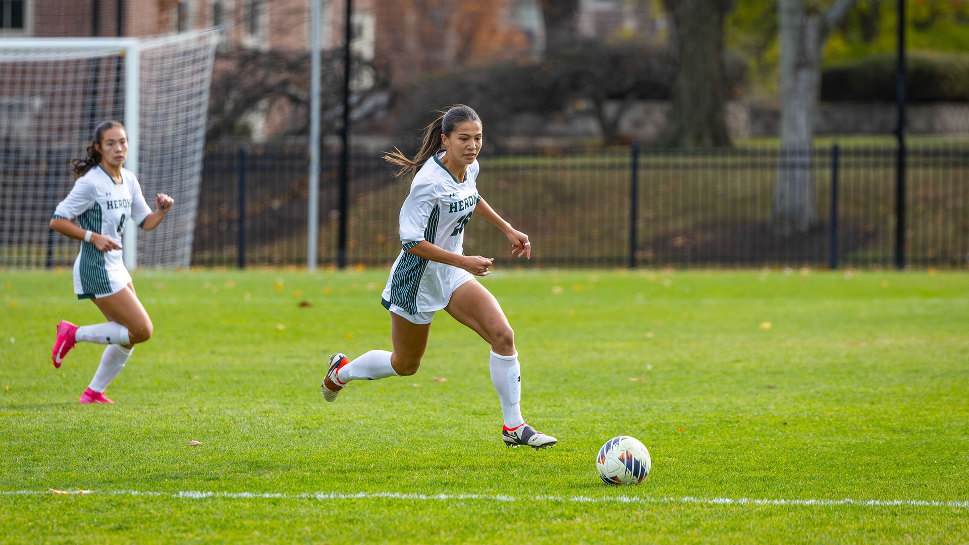 Izzy Thors dribbles downfield against RIT