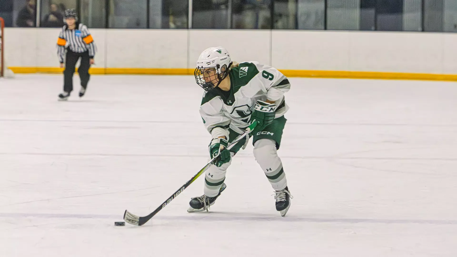 Ainsley Lonczak possess puck into offensive zone