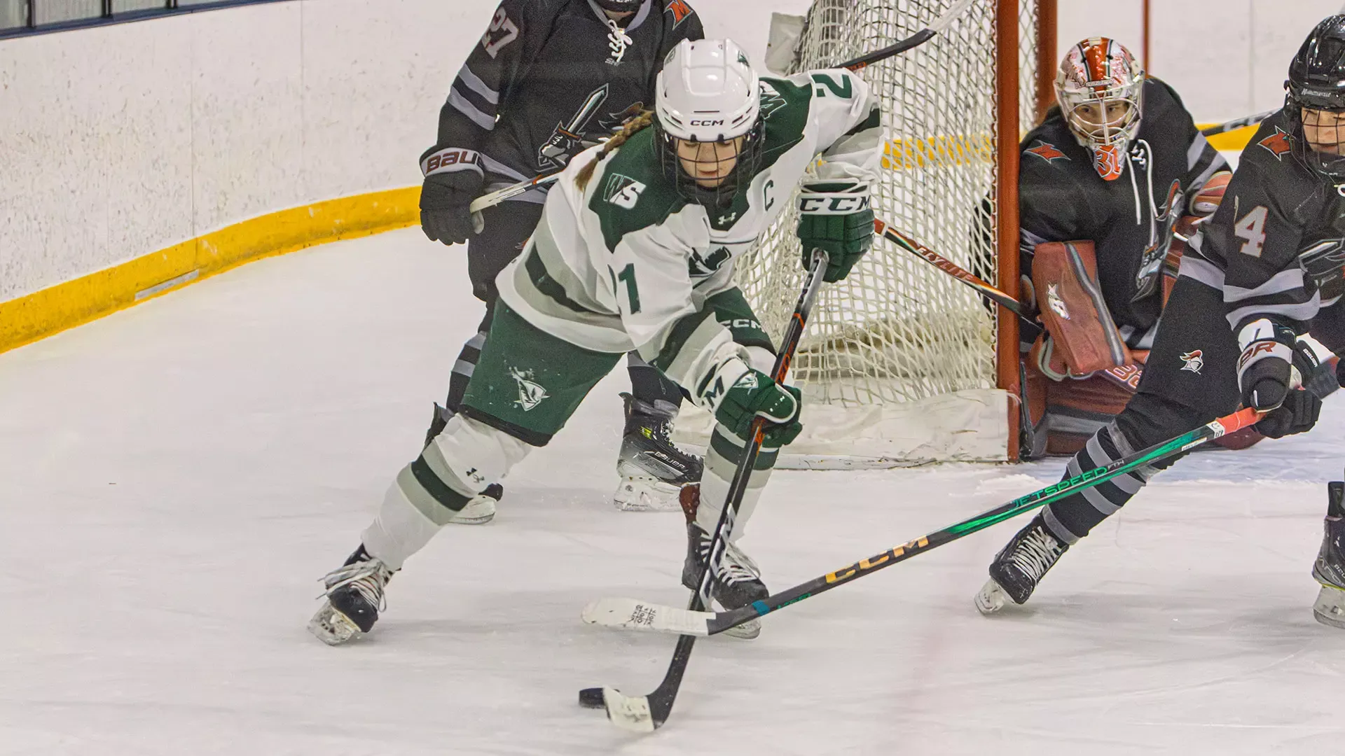 Kelly Howe with puck on goal line