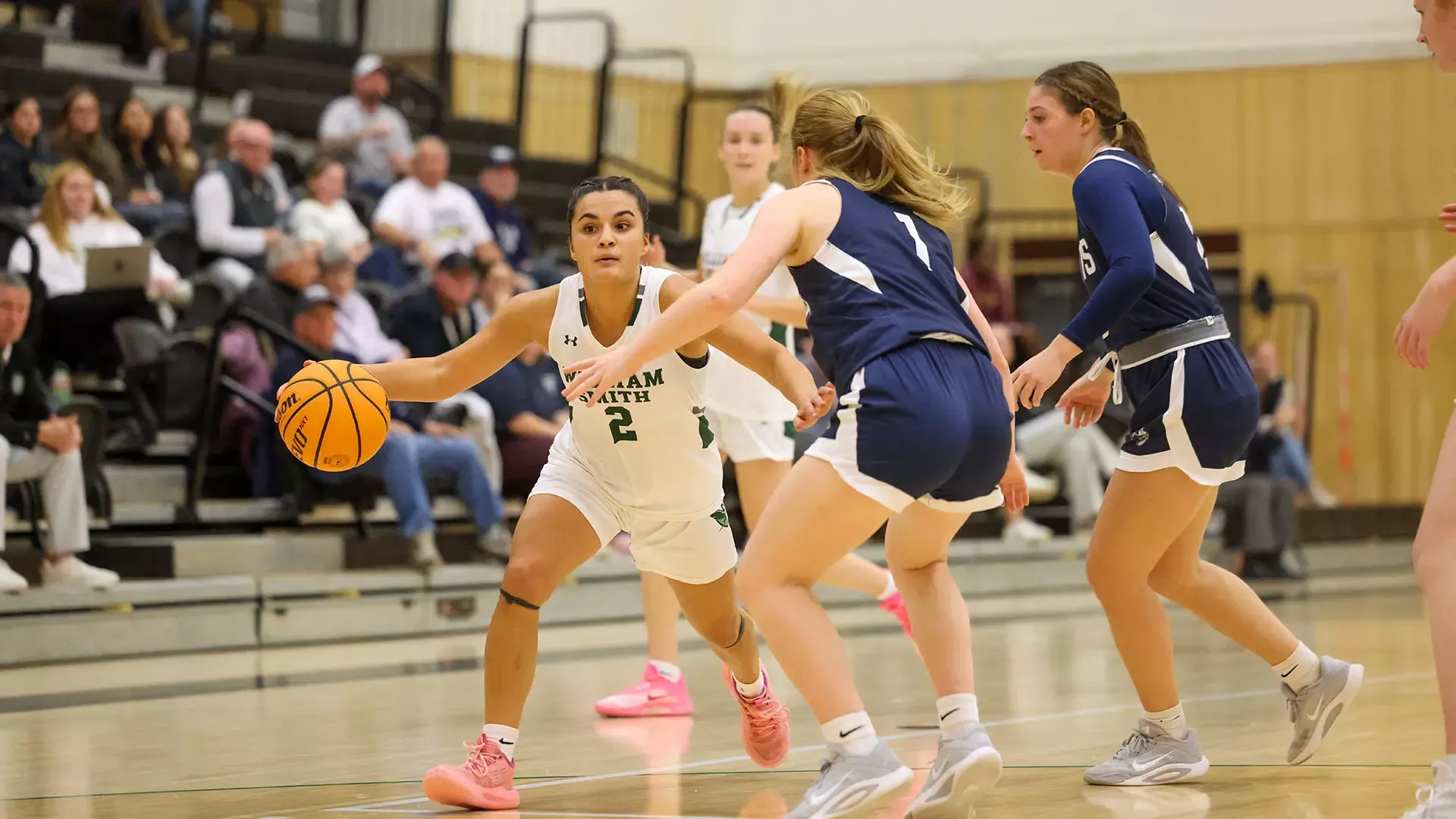 Ava Lobozzo dribbles by defender 