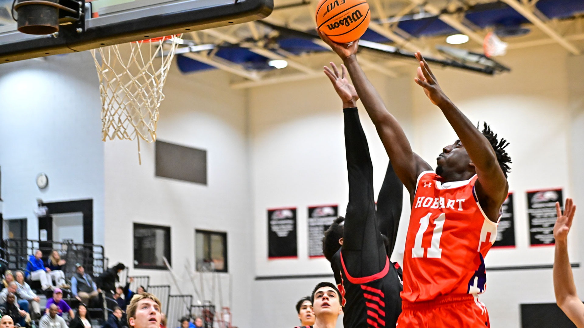 Allen Mordi puts up a shot against Bard.