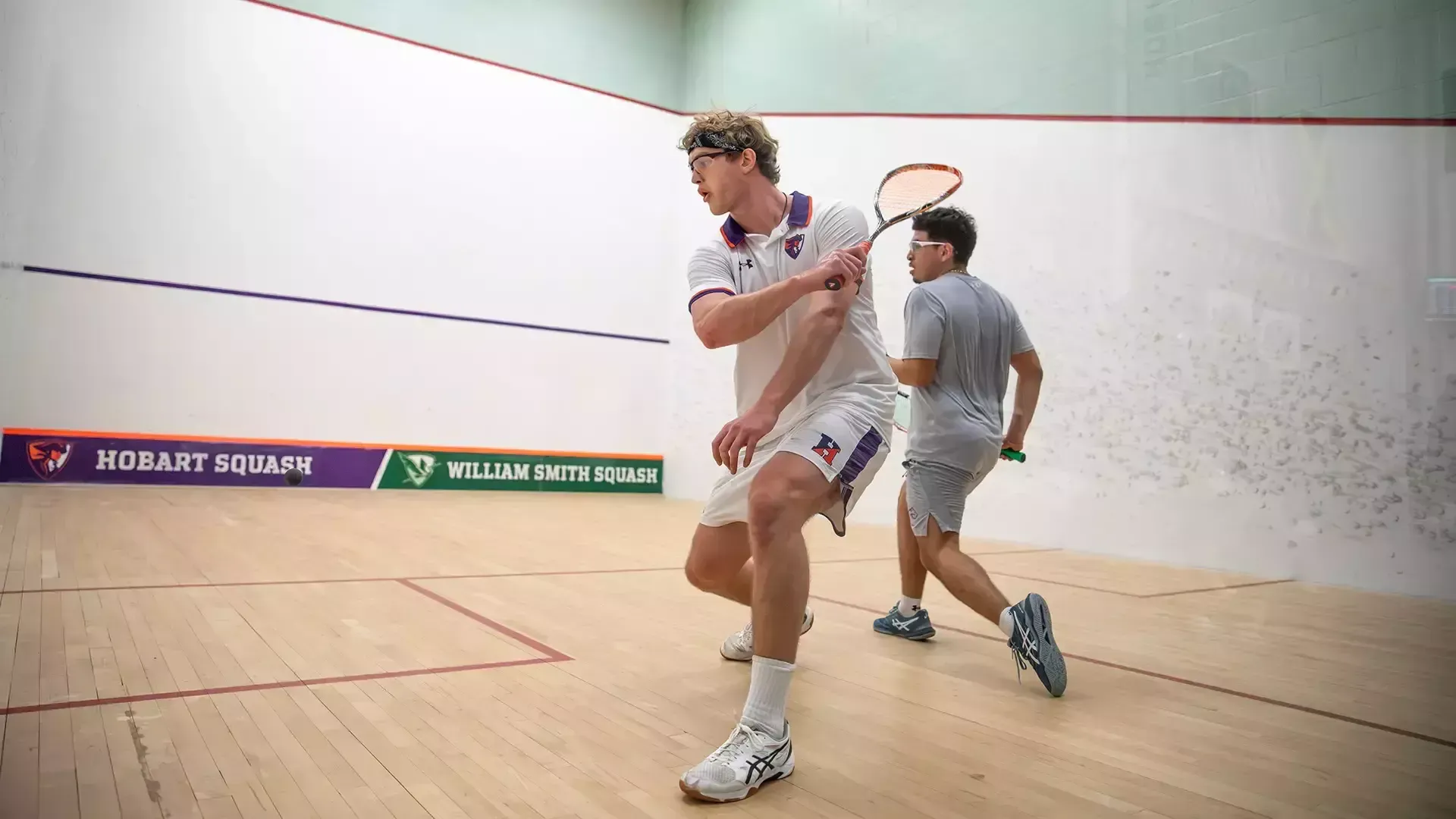 Mason Graham swinging the racket