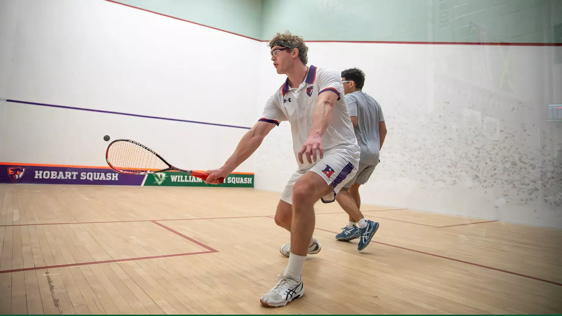 Mason Graham swinging the racket