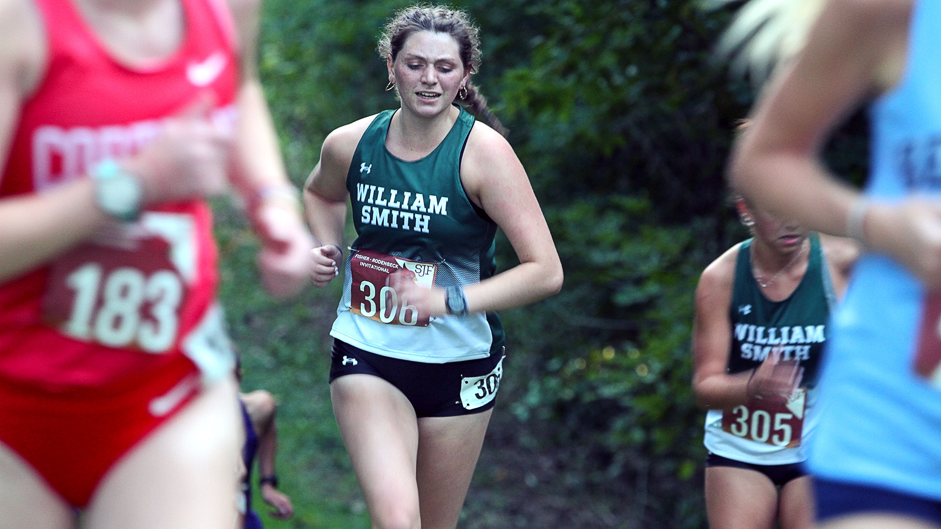 Megan Ingraham runs up a hill during the Rodenbeck Invitational.