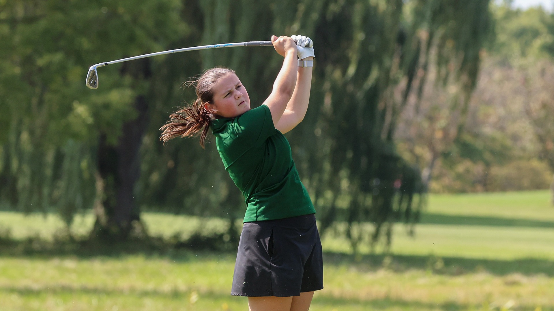Maggie McCarthy watches her tee shot.