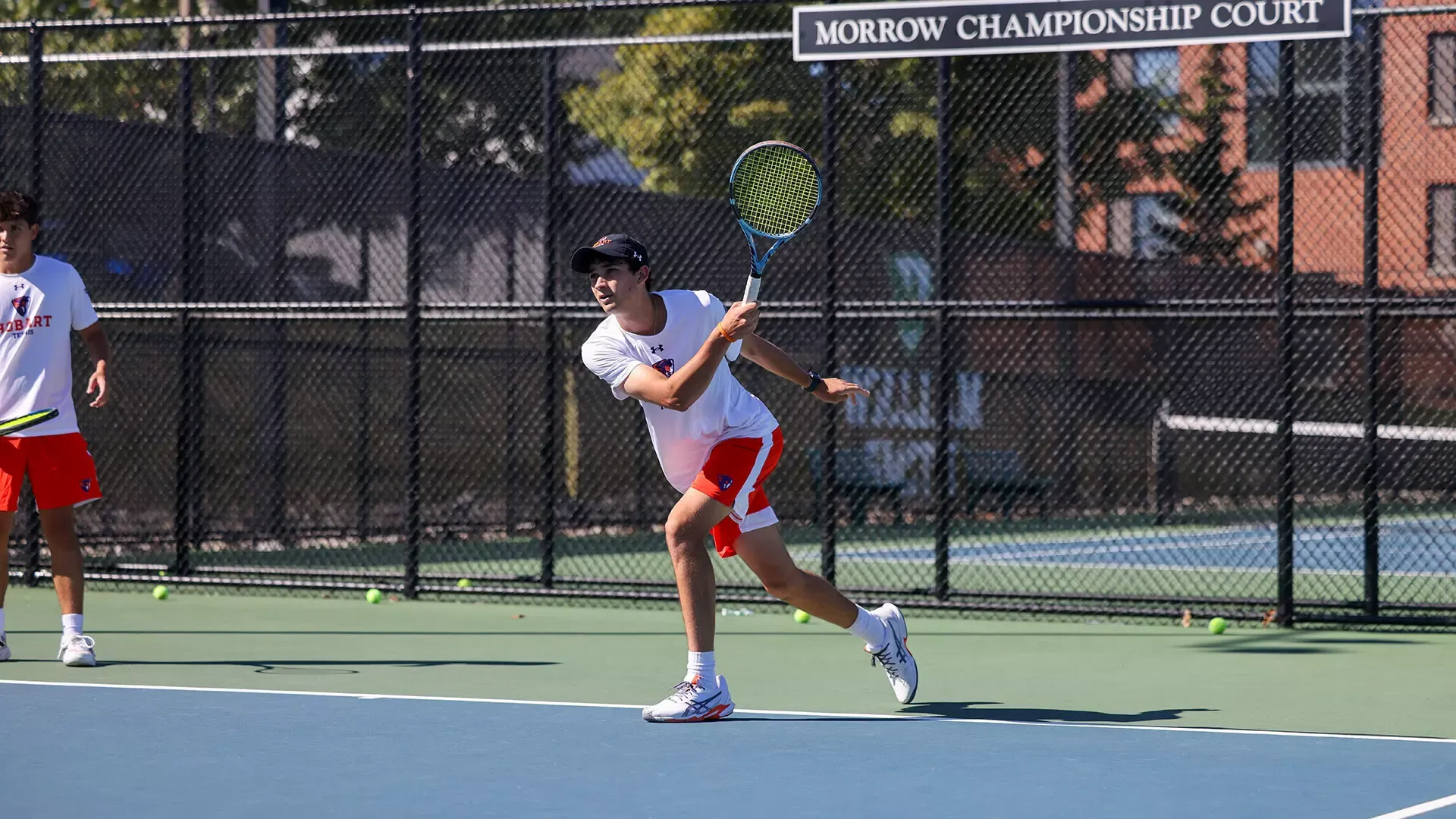 Tejus Ranadive follows through after a forehand return 