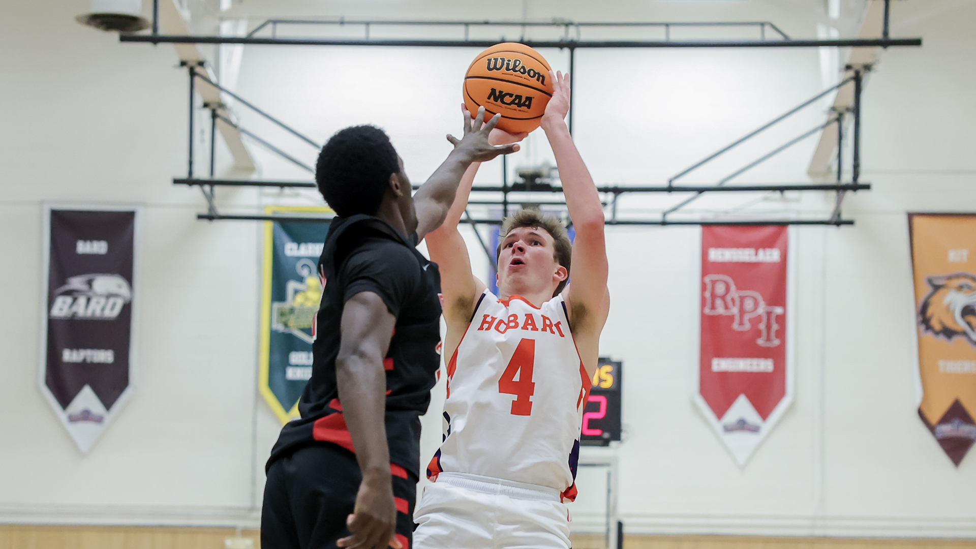 Alex Moesch launches a jumper over a defender.