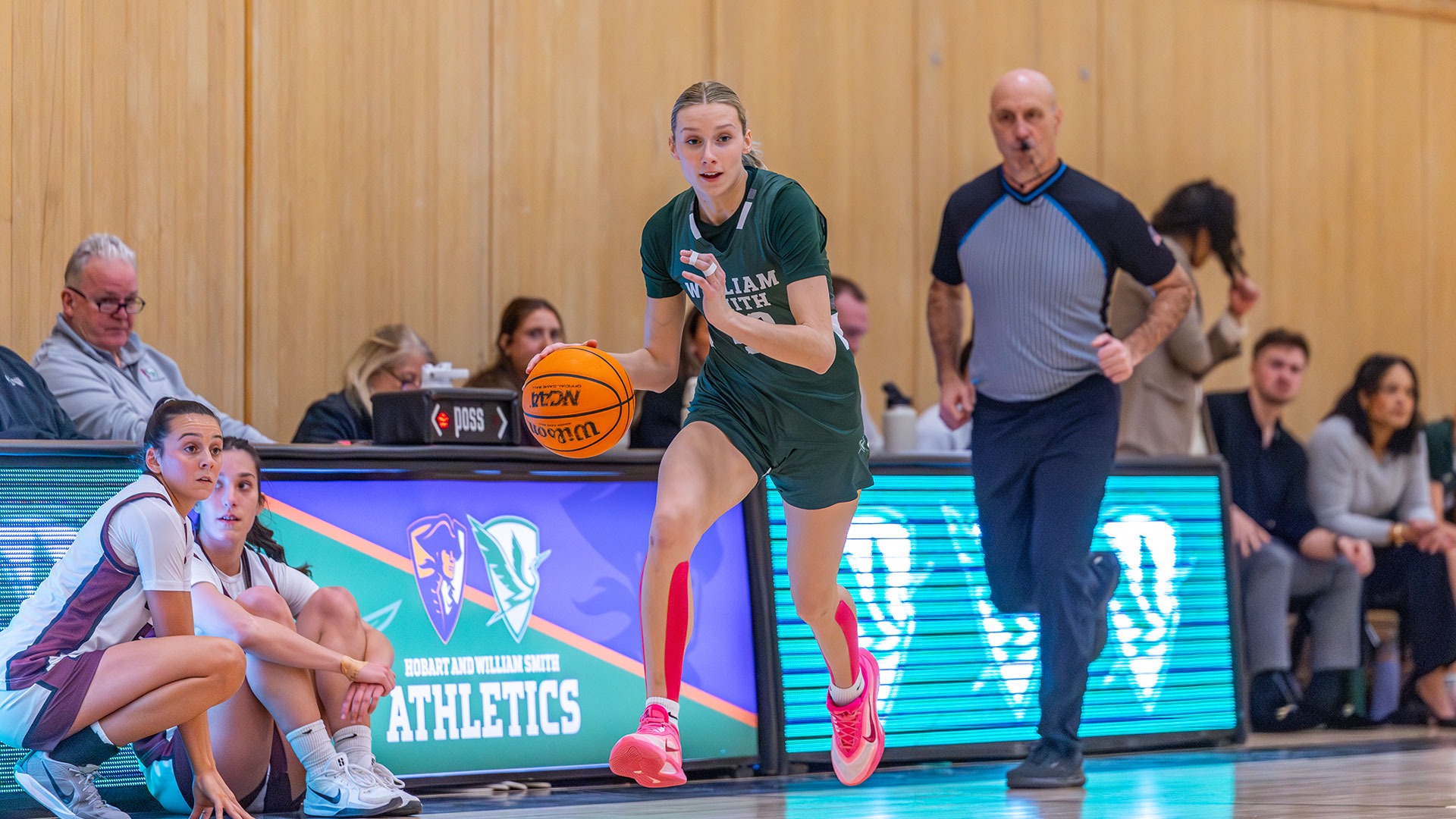 Amelia McCulley dribbles across midcourt.