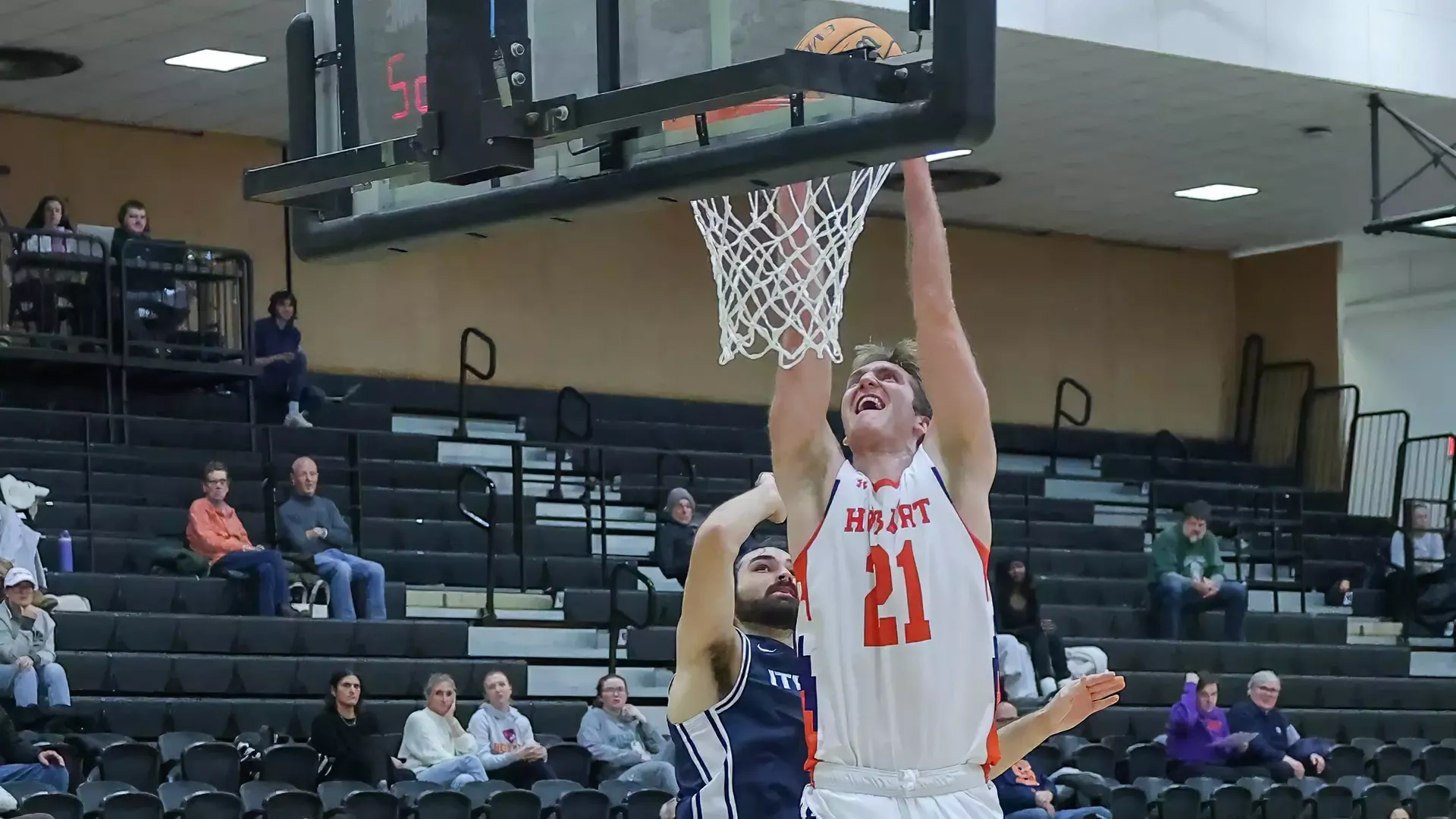 Niko Lutz throws down a dunk against Ithaca.