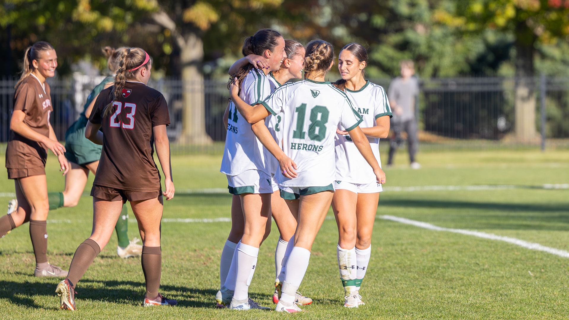 William Smith soccer celebrates Miranda DeMura's goal against St. Lawrence