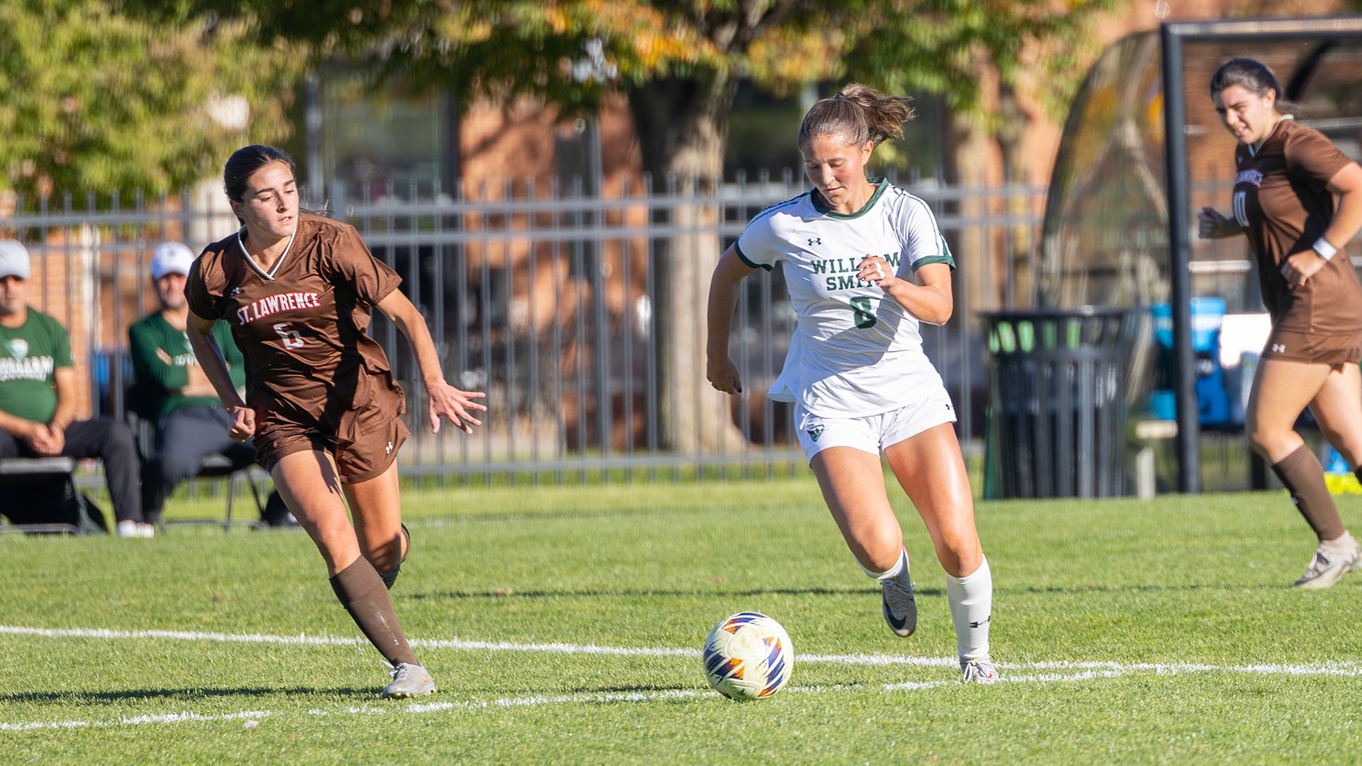 Brynn Schneider dribbles the ball into the attacking end of the field