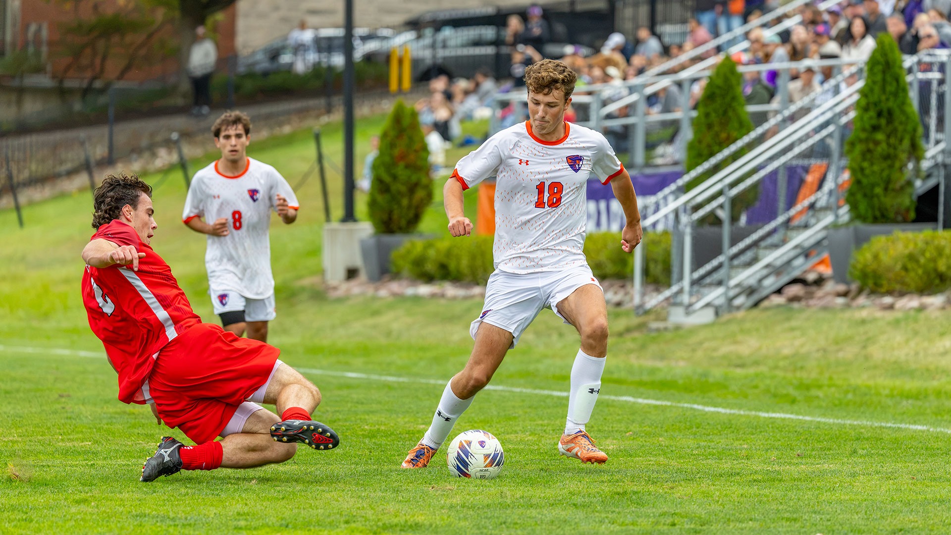 Ryan Sewell carries the ball downfield against Cortland