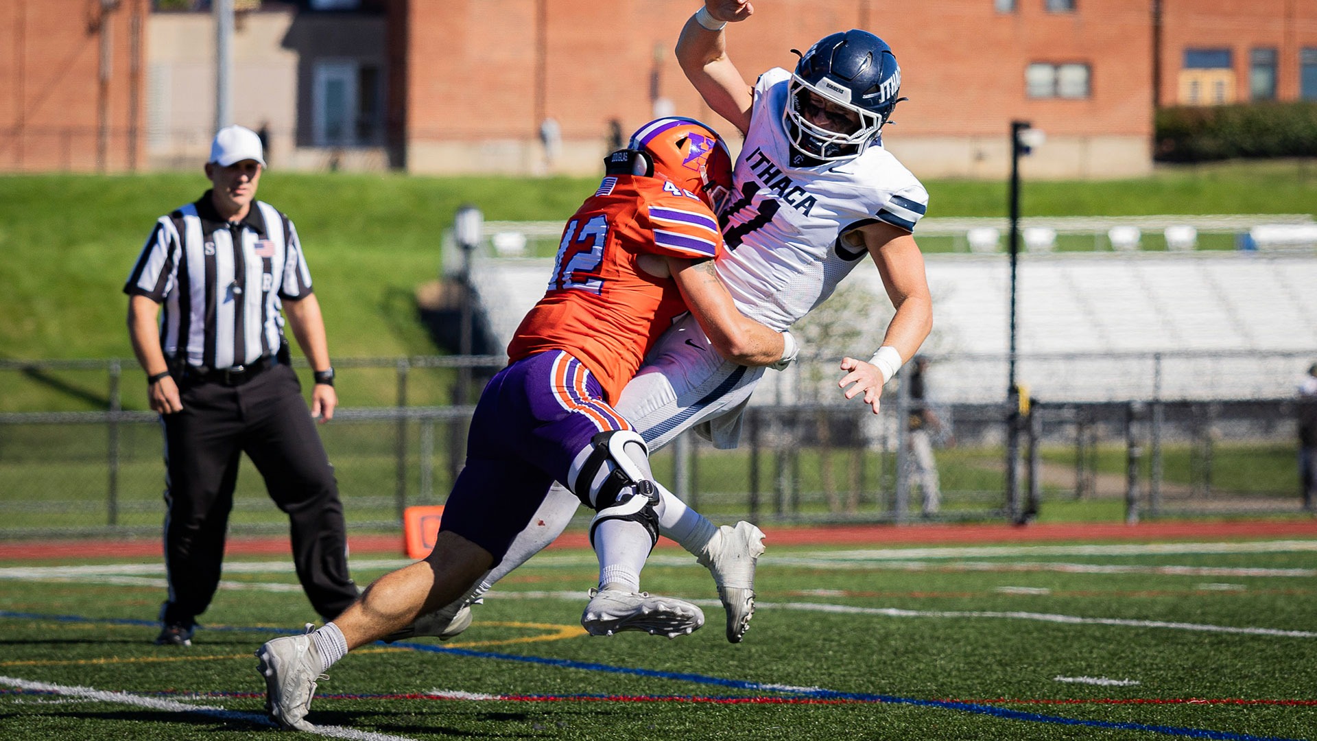 Tyler Cumming hits the Ithaca quarterback.