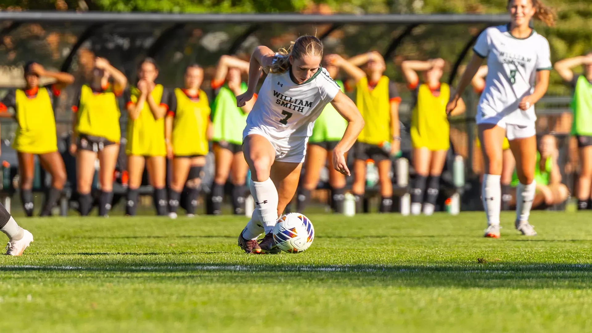 Kristin Middaugh dribbles through the RIT defenders. 