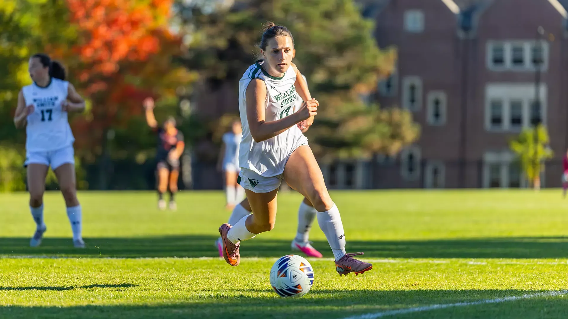 Grace Metzler carries the ball into the 18-yard box. 