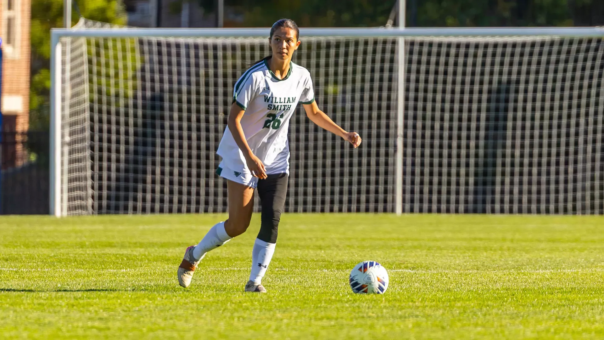 Izzy Thors looks upfield while preparing to pass the ball to a teammate.