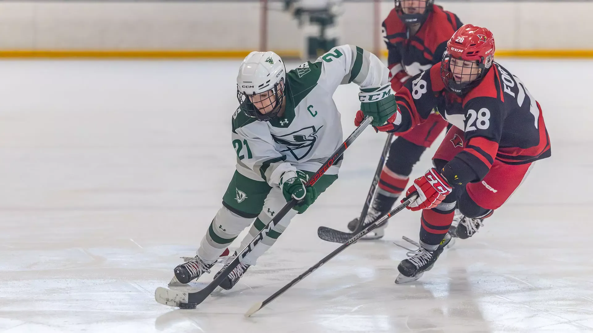 Kelly Howe skates by defender