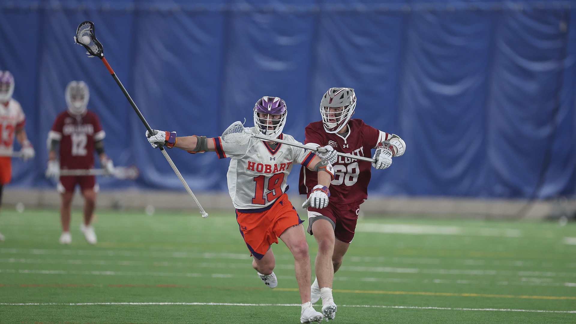 Nickolas Sotiropoulos protects his crosse from a Colgate player.