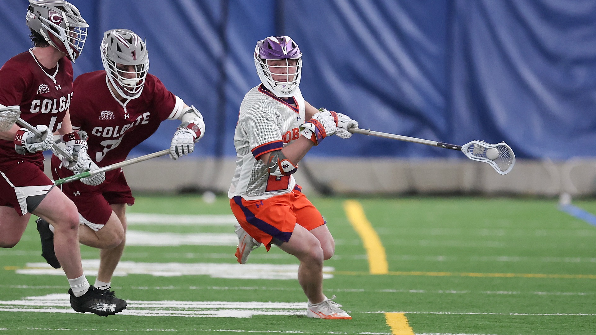 Seamus Schofield wins a faceoff against Colgate.