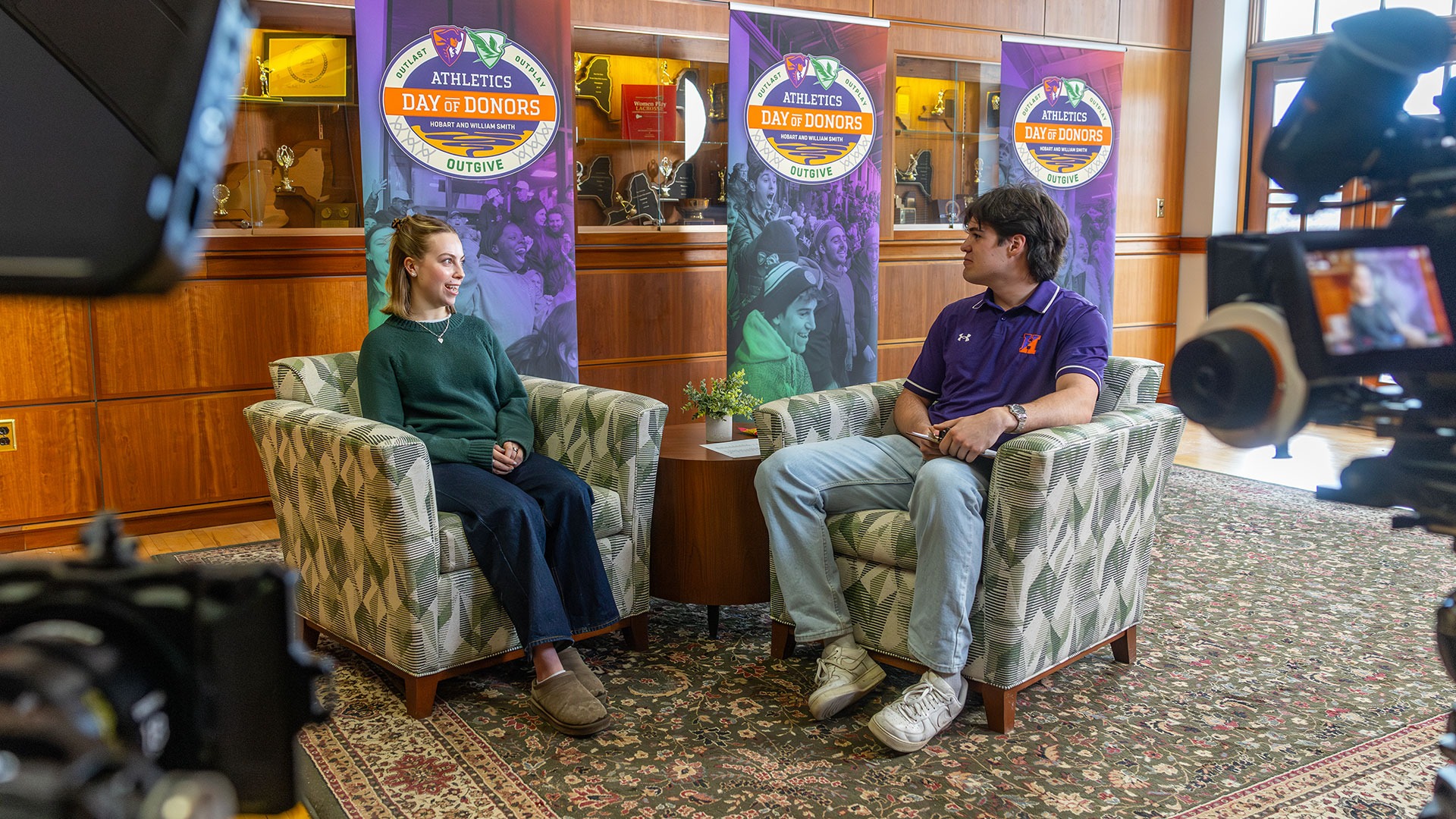 Nathan Deller' 27 interviews Emily Cain '27 during Athletics Day of Donors. 