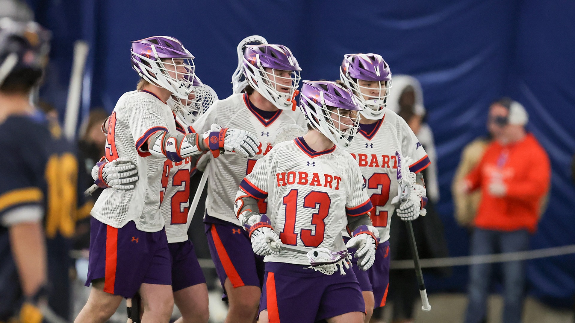 Teammates celebrate with Daniel Cano (#13)