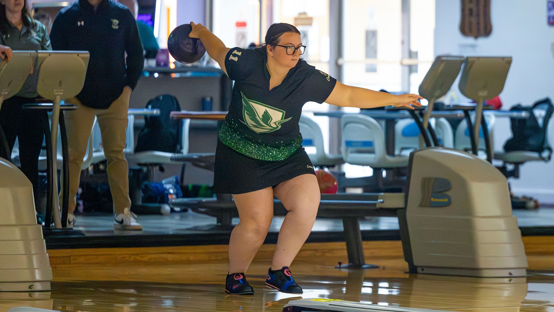 Caitlyn Anschutz bowls during a match against Roberts Wesleyan at Sunset Bowl.
