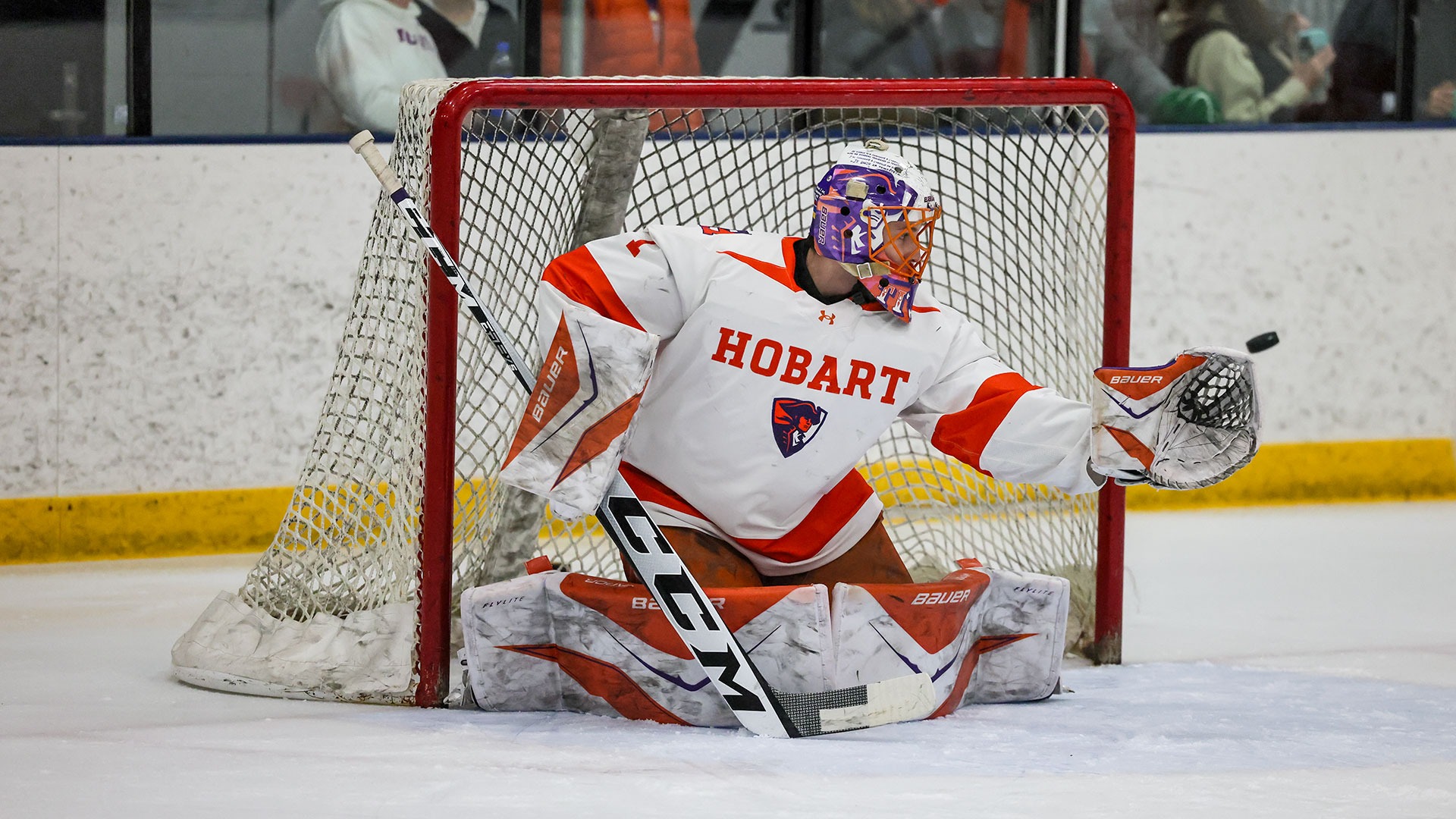 Mavrick Goyer watches a puck go into his glove during warm ups. 