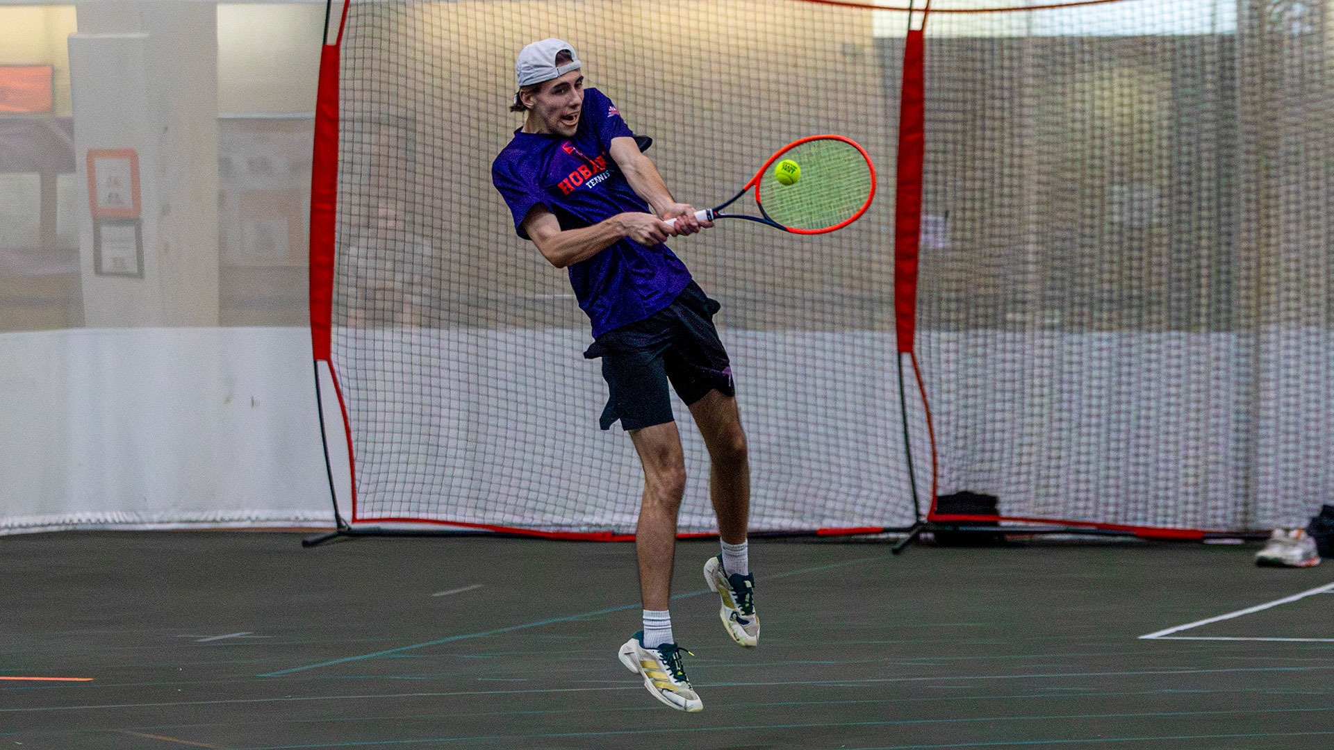 Nick Fischer returning a serve