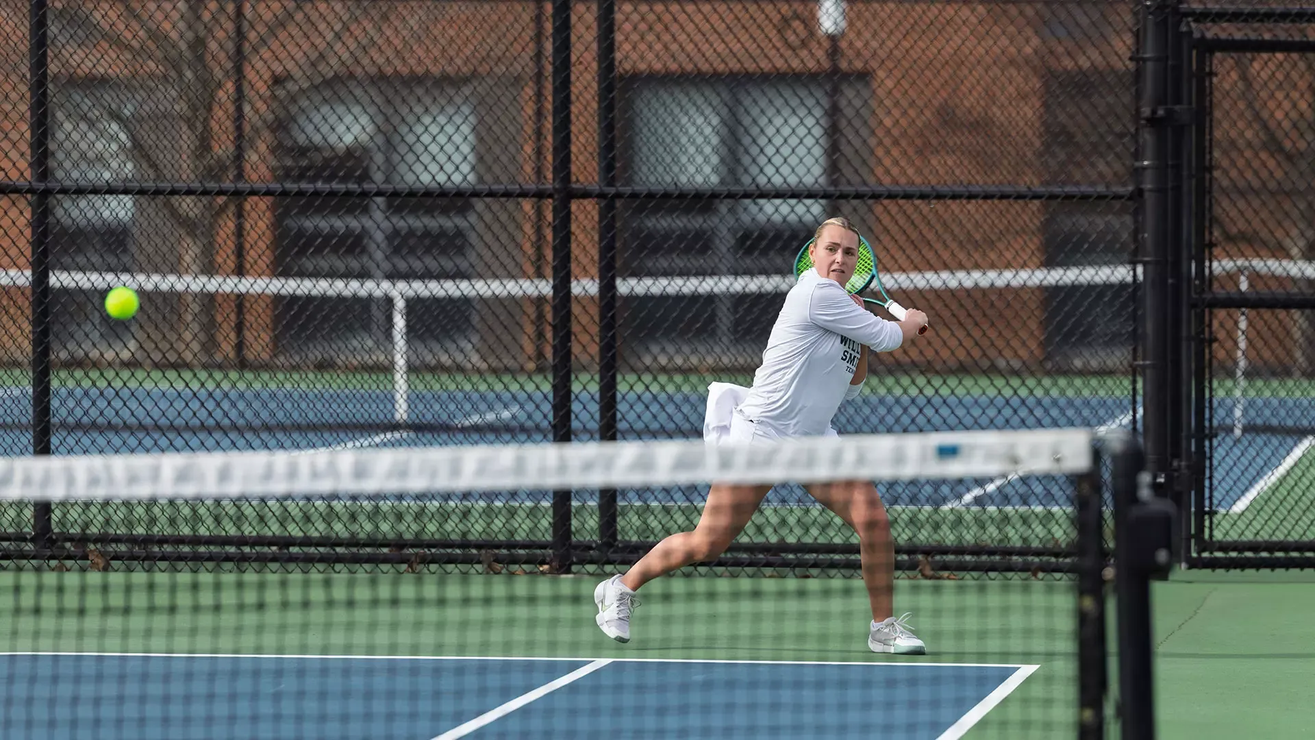 Mae Kellersman runs to hit a backhand 