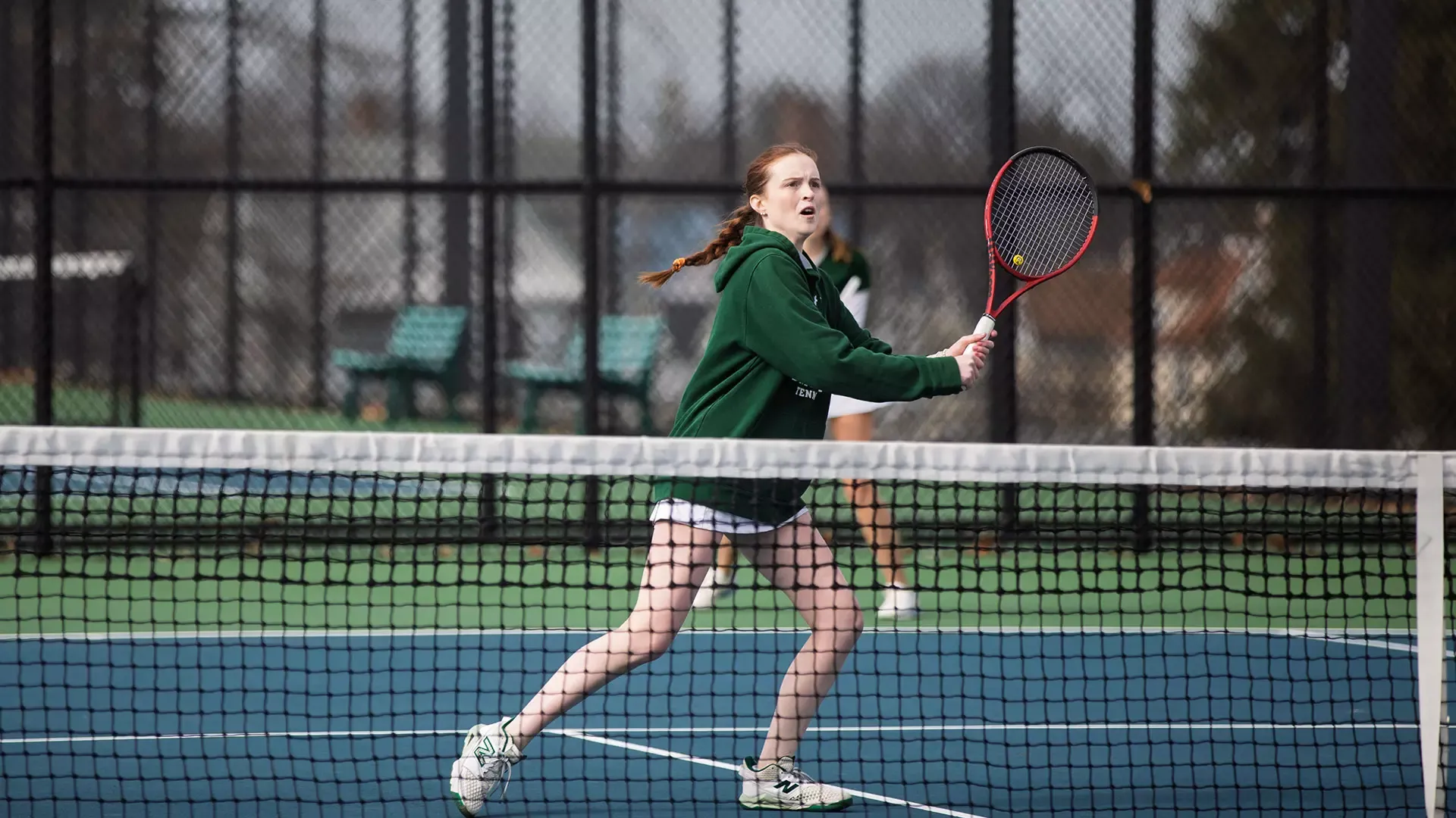 Maddy Buck hits a backhand volley