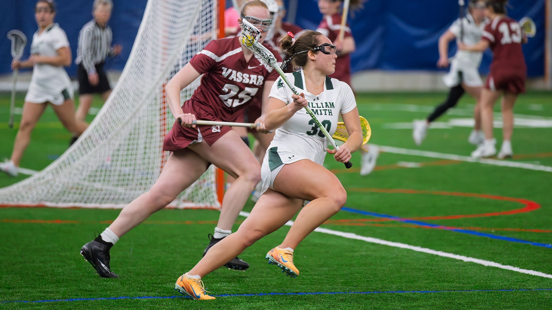 Mia Falco runs to the front of the cage