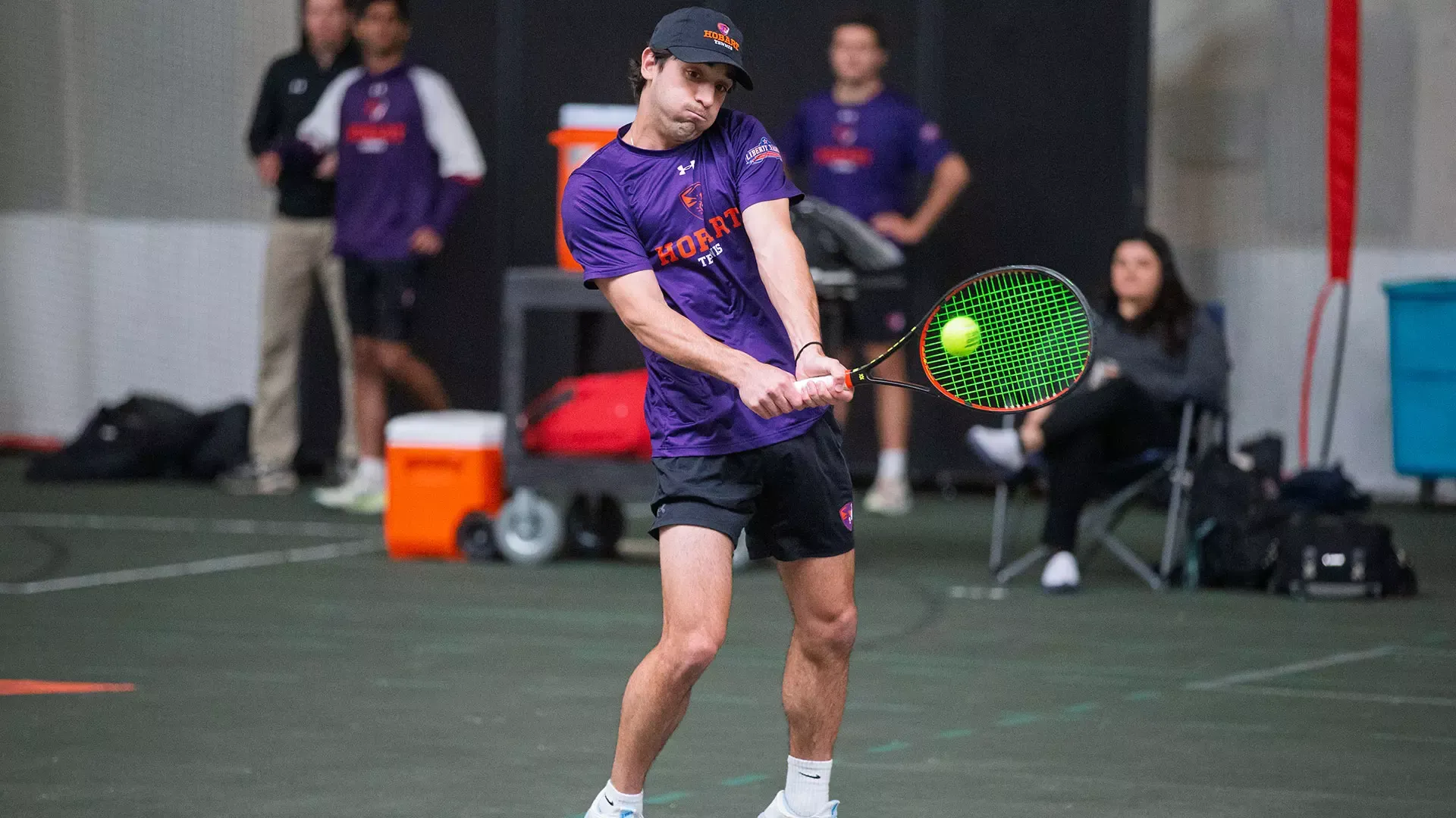 Achilleas Kousaridis hits a backhand shot