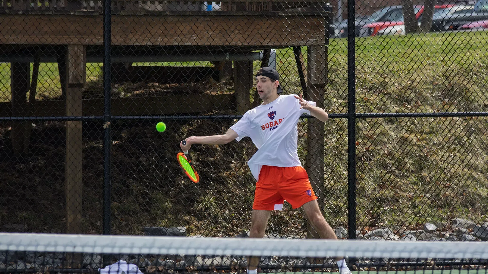 Nick Fischer hits an open stance forehand 