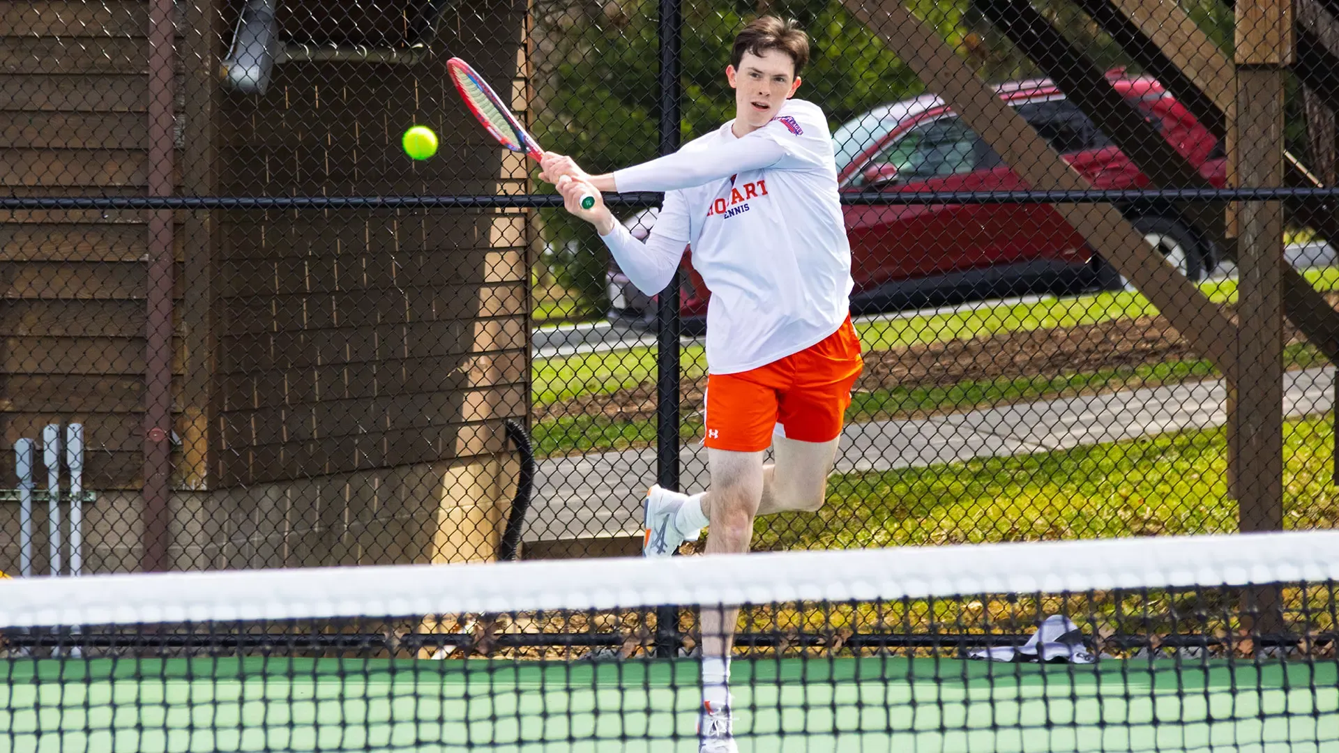 Aidan Staunton hits a cross-court forehand 
