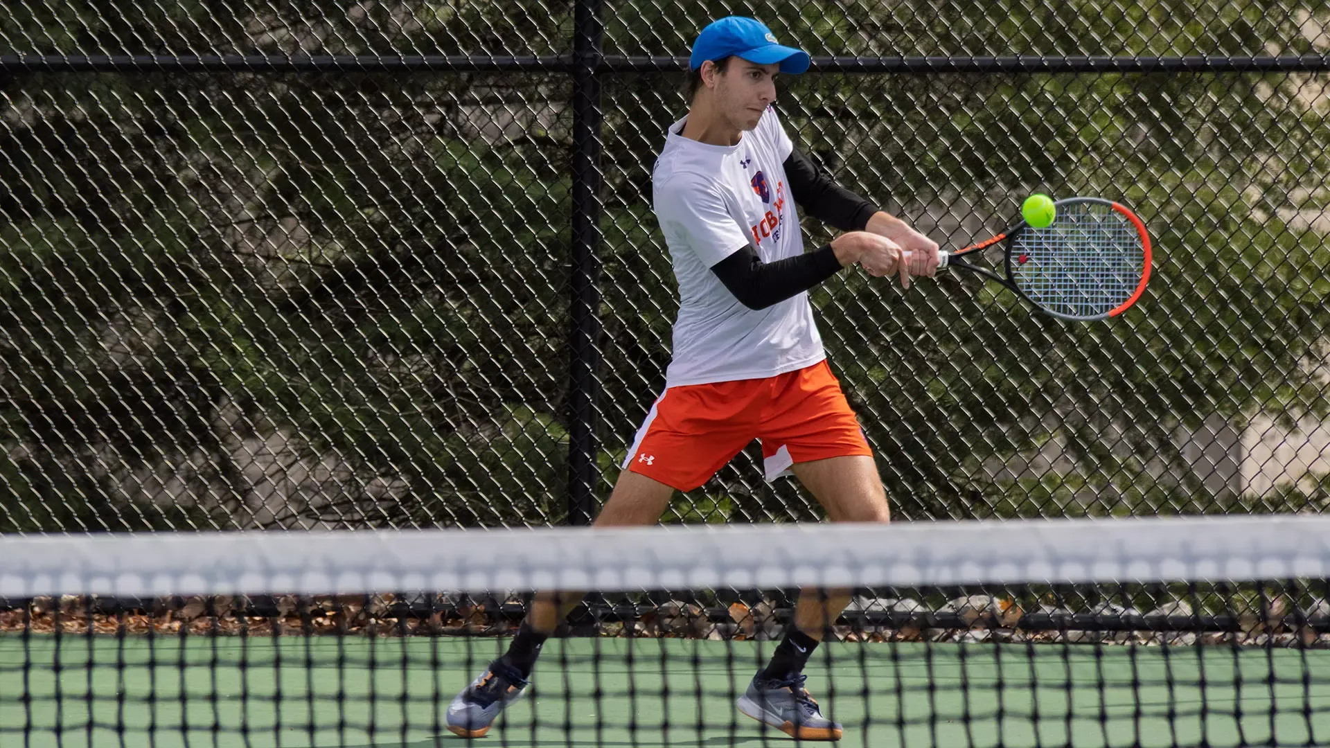 Michael Georgelis hits a backhand 